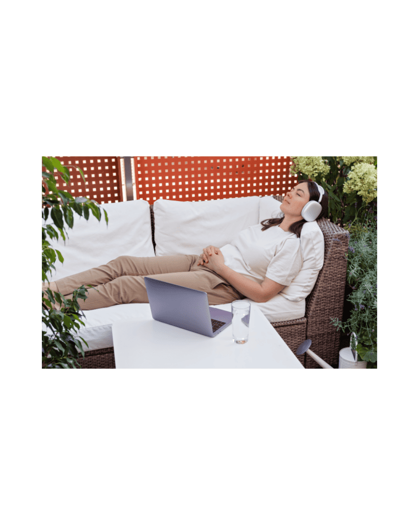 Woman relaxing with headphones during a guided hypnotherapy session, promoting stress relief, anxiety reduction, and subconscious transformation.