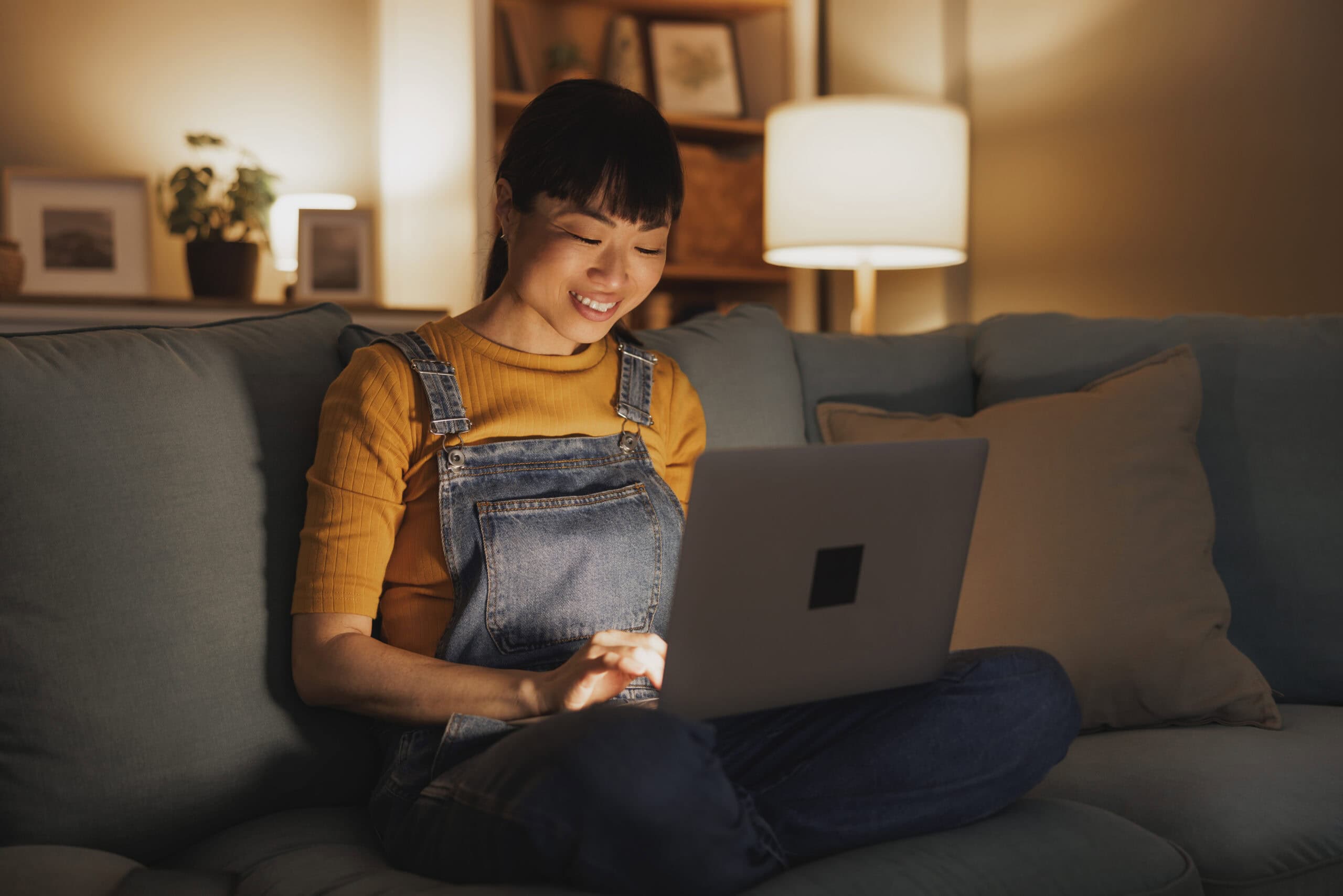 Woman using her laptop at home for an online session