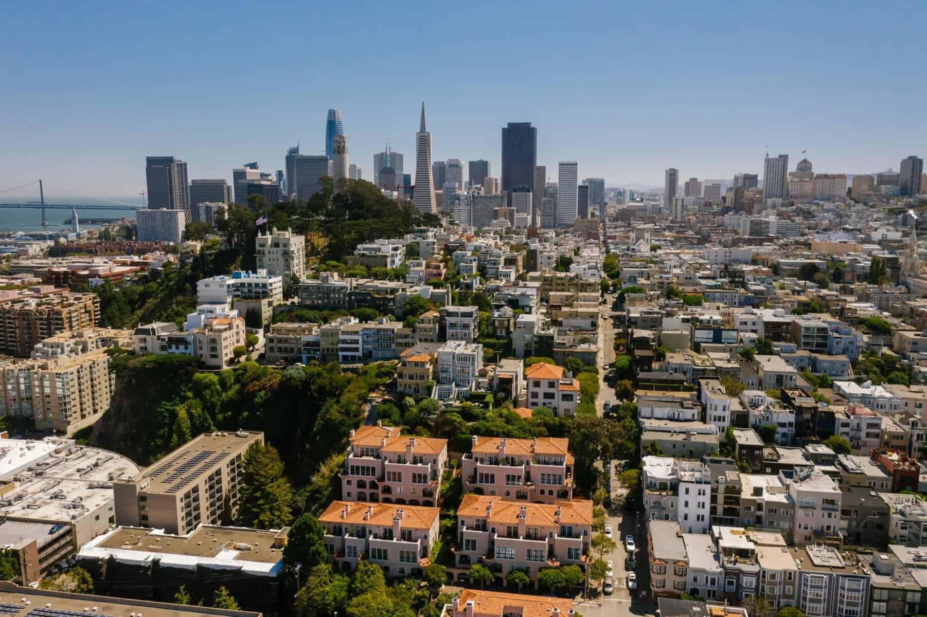 Aerial view of San Francisco skyline with tall buildings and cityscape.