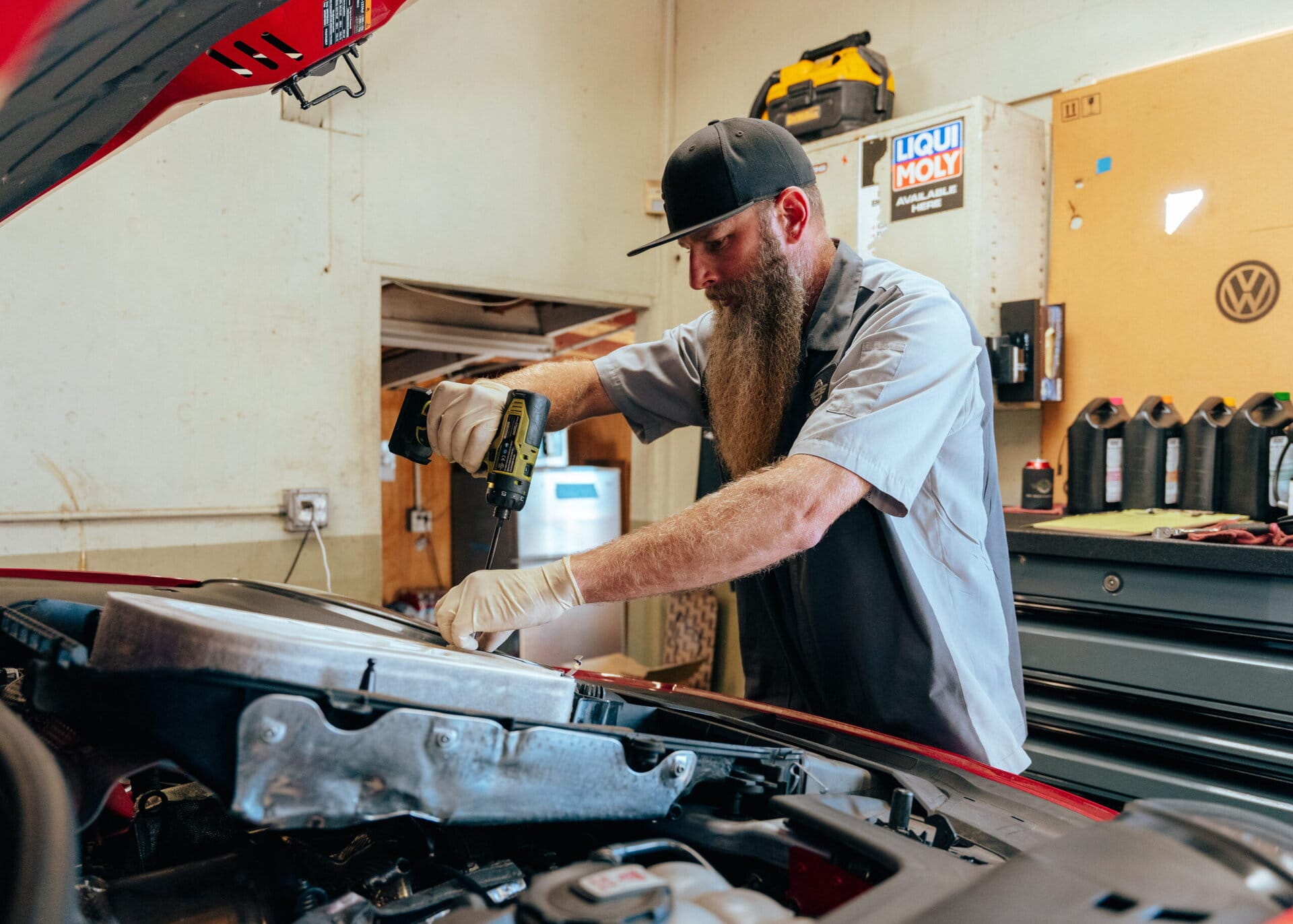 Experienced mechanic performing engine repair and maintenance in a professional auto shop. Skilled in diagnostics, repairs, and servicing for all vehicle makes and models.