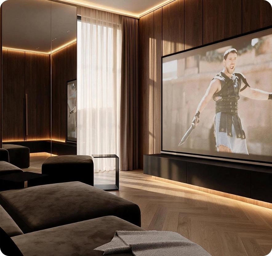 Elegant home theater with large screen, plush seating, and warm lighting.