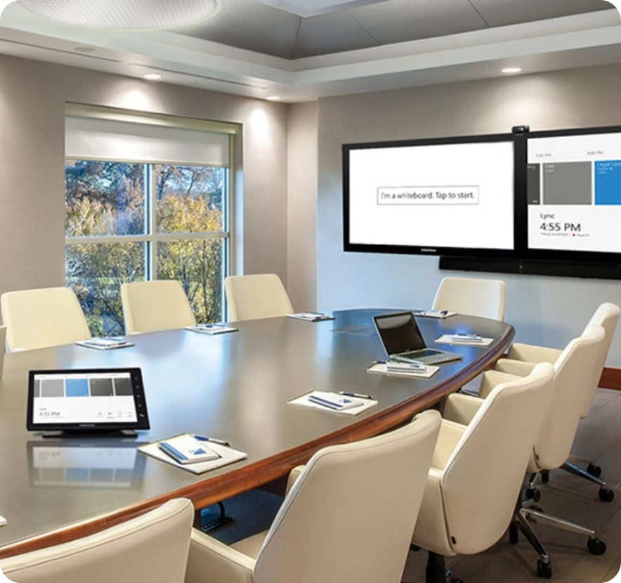 Modern corporate conference room with large screen and tablets for meetings.