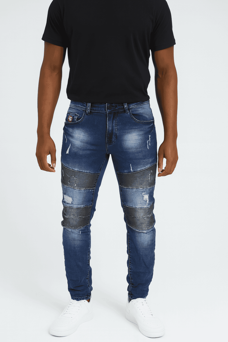 Distressed blue jeans with bold streetwear style, perfect for urban fashion statements.