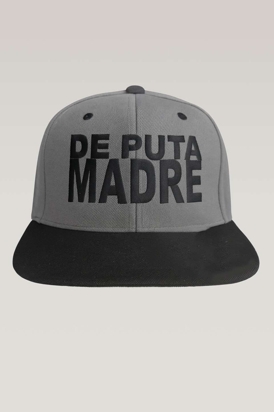 Bold grey and black snapback hat with "De Puta Madre 69" logo.
