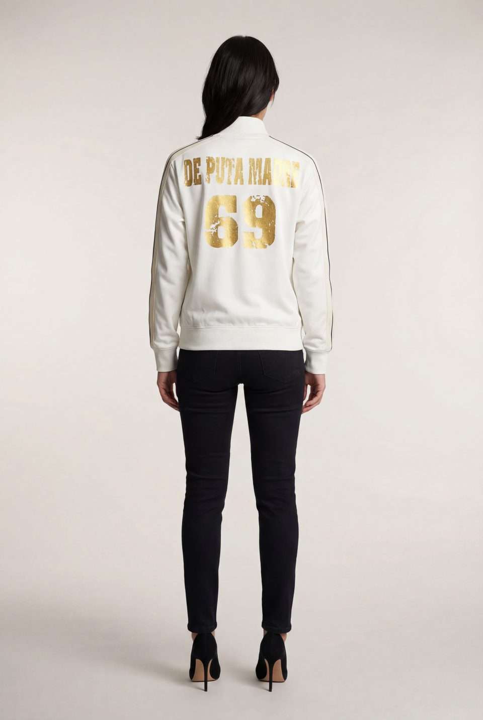 Bold white streetwear jacket with gold "De Puta Madre 69" print on the back.