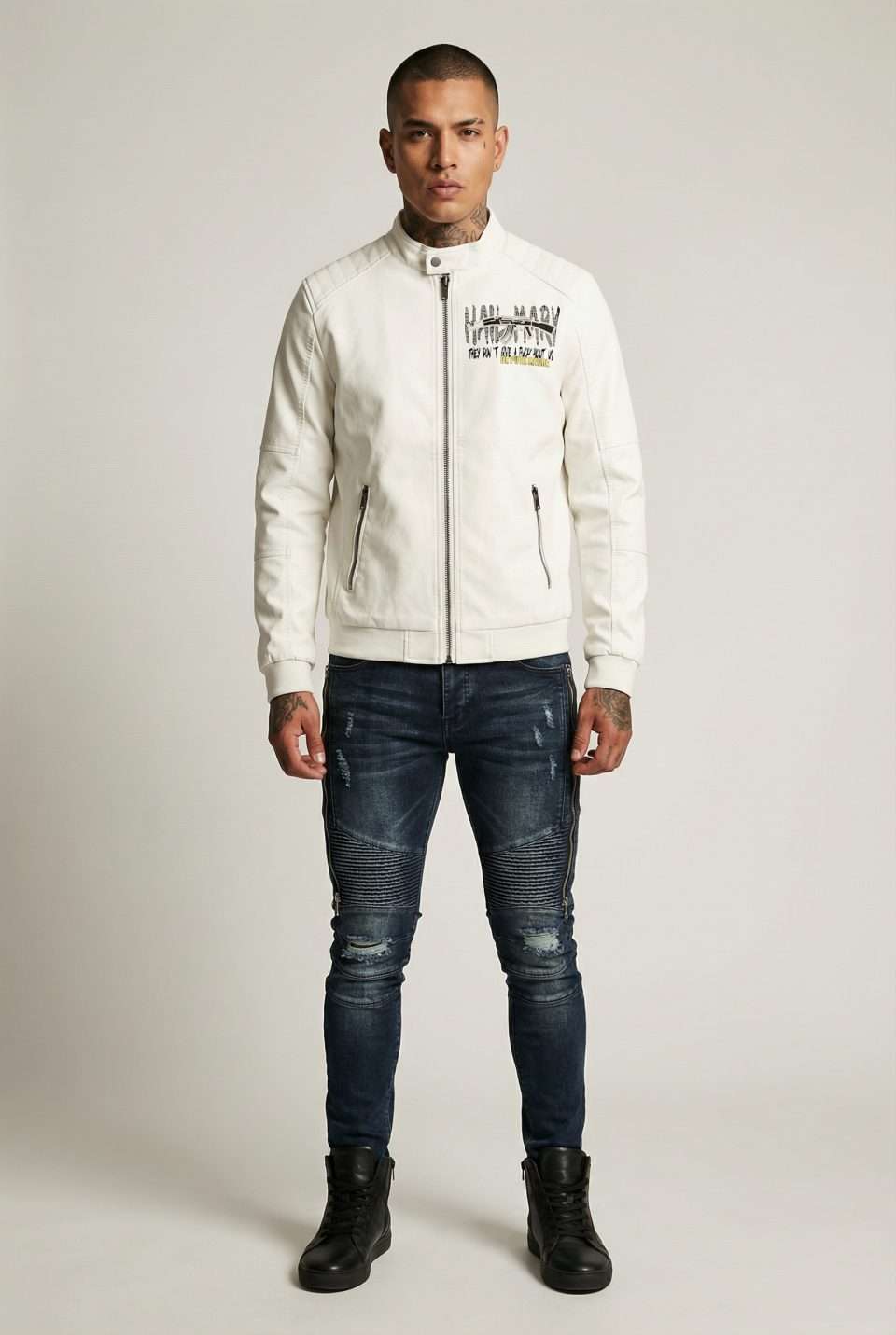1. White leather jacket with edgy graphic design and zip pockets.