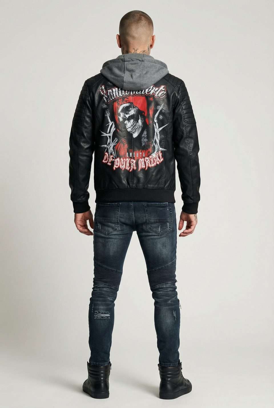 Skull graphic leather jacket with bold Italian streetwear branding, styled with distressed denim.