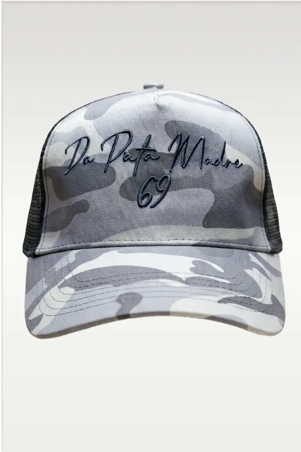 Camouflage baseball cap with embroidered "De Puta Madre 69" logo and urban streetwear style.