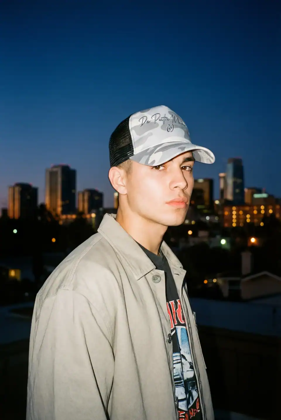 1. Trucker cap with bold "De Puta Madre 69" logo and camouflage design.