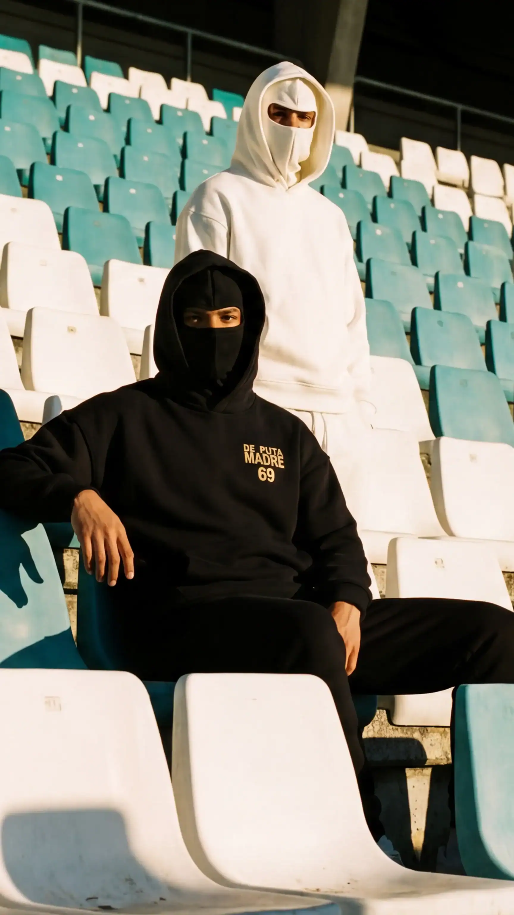 1. Black hoodie with "De Puta Madre 69" logo, streetwear style, urban luxury fashion.