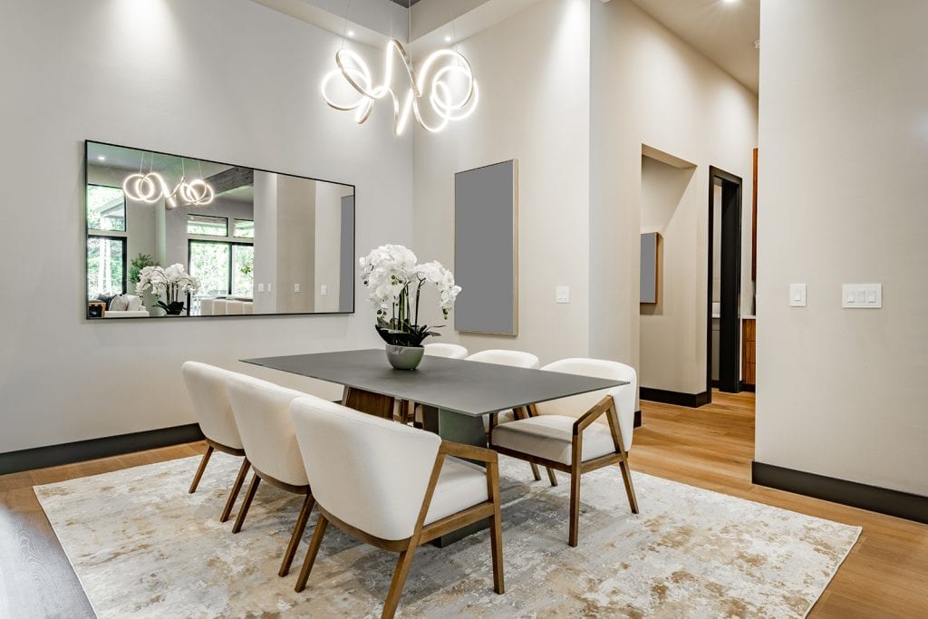Rug with dining room table and chairs on top.