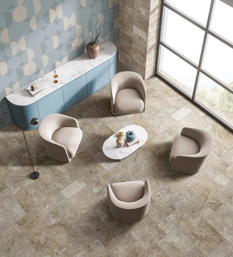 Chairs, table, and cabinet on stone floor.