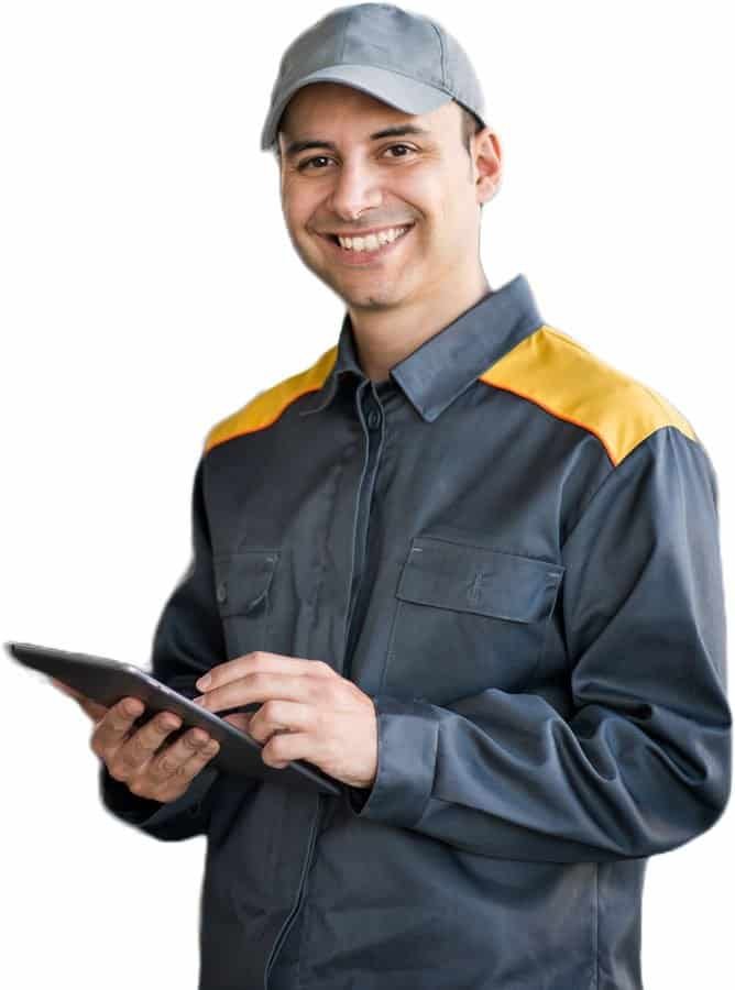 Steel industry worker in uniform holding a tablet at Devansh Steels.