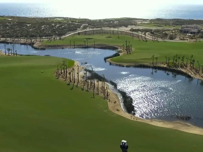 Oasis Short Course At Diamante Los Cabos Surrounded By Palm Trees And Desert Landscape
