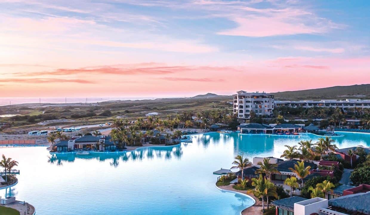 Living At Diamante Cabo San Lucas β 7 Reasons It Is Considered As A World-Class Luxury Community β Homes For Sale In Diamante Aerial View Of The Crystal Lagoon And Luxury Residences At Diamante Cabo San Lucas During Sunset