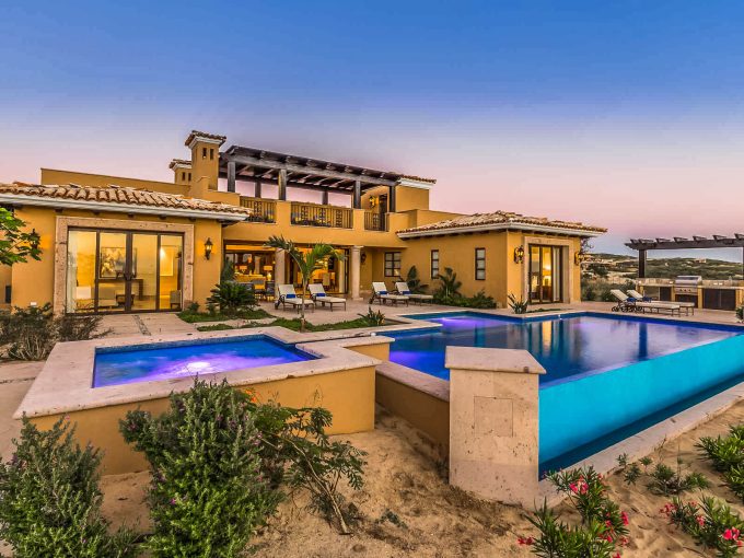 Is Diamante A Good Place To Buy In 2025? Luxury Golf Villa With Infinity Pool And Hot Tub At Sunset, Showcasing High-End Architecture And Desert Landscaping.