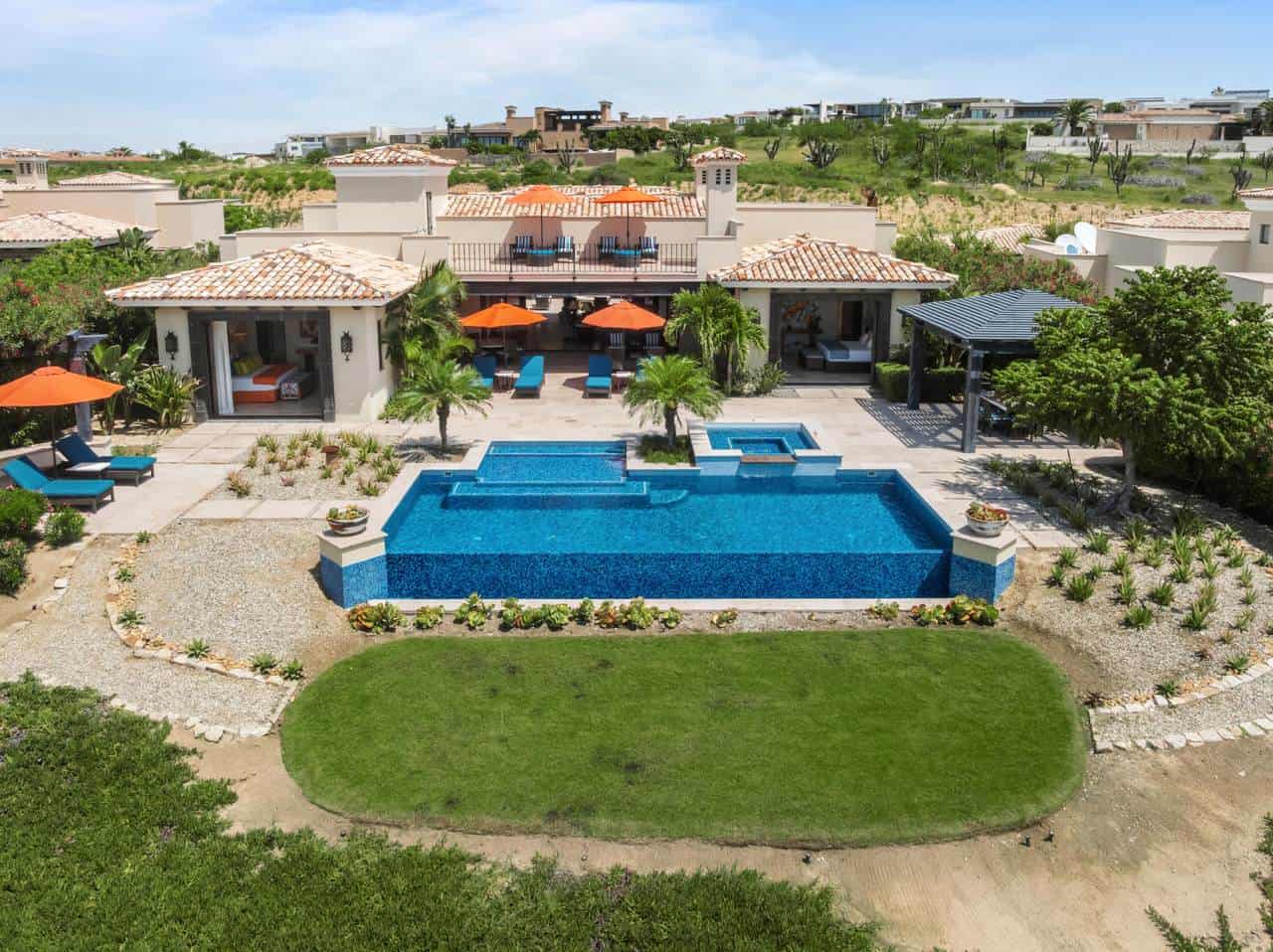 Diama. A Stunning Luxury Villa In Cabo San Lucas Featuring A Large Swimming Pool, Outdoor Lounging Areas, And Beautifully Landscaped Gardens, Perfect For Relaxing And Entertaining.
