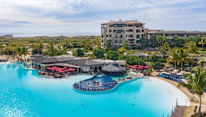 Kayaking At Crystal Lagoons® – Diamante Beaches And Pools Kayakers Enjoying The Calm Waters Of The Crystal Lagoons® At Diamante Beaches And Pools, Surrounded By Palm Trees And Golden Baja Dunes.