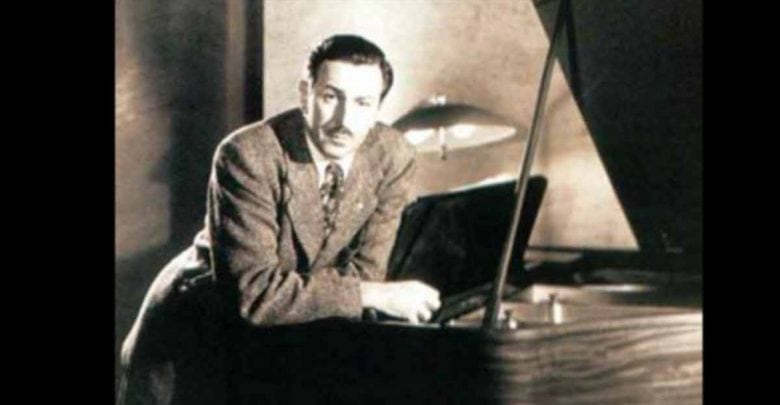 Walt Disney Leaning On Piano