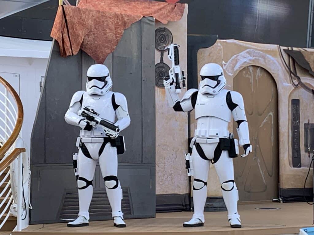 Stormtroopers take the stage amid sci-fi props, immersing guests in The Disney Fantasy’s Star Wars adventure.