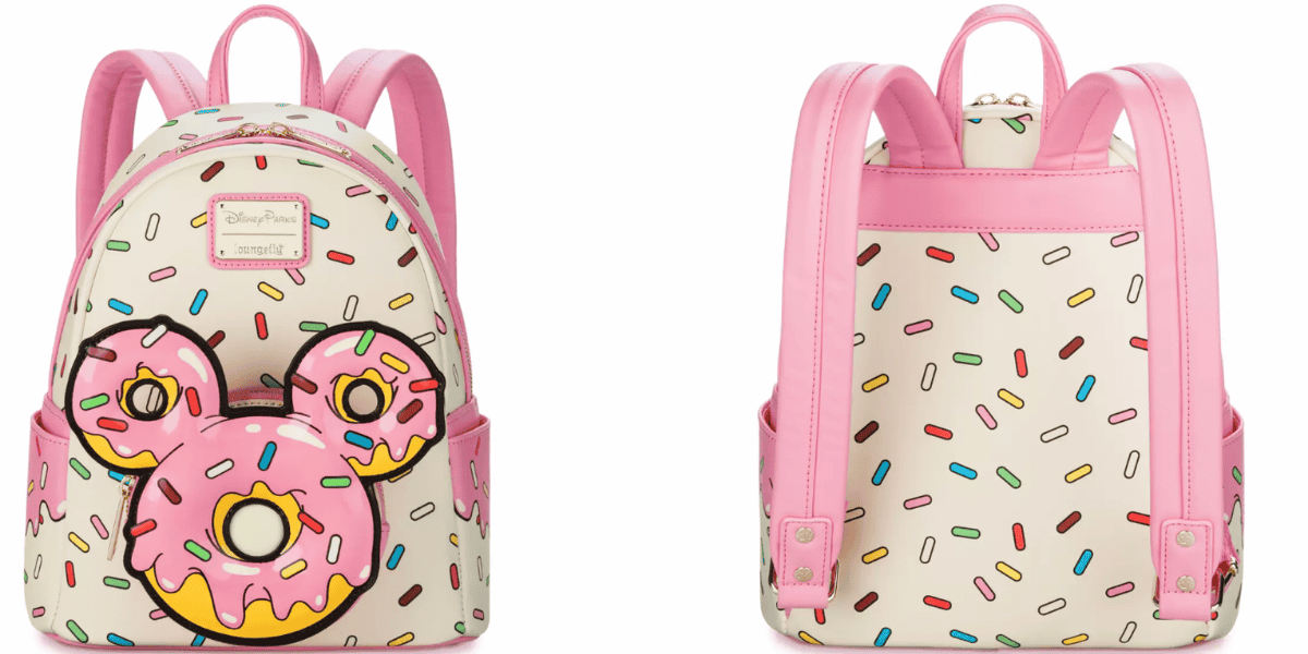 A charming addition to the Mickey Mouse Donut Collection, this backpack features pink straps and trim adorned with colorful sprinkles and an image of three pink frosted donuts forming a mouse shape. The front includes a zipper pocket and gold brand logo, while the back showcases adjustable straps.