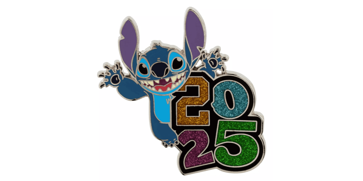 A colorful enamel pin featuring a blue animated character with big ears, excitedly waving. The character is positioned next to the numbers "2025" in bold, glittery colors: gold, orange, green, and purple.