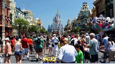 Crowds in front of Cinderella Castle at Magic Kingdom at Disney World.