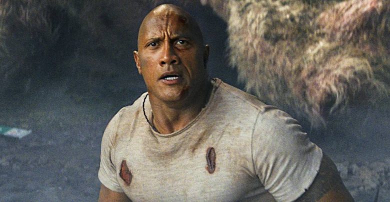 A determined hero in a rugged, torn shirt faces thrilling danger, evoking the excitement of a live Disney action stunt show.