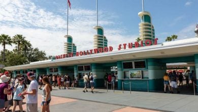 Guests outside of Disney's Hollywood Studios entrance at Disney World park.