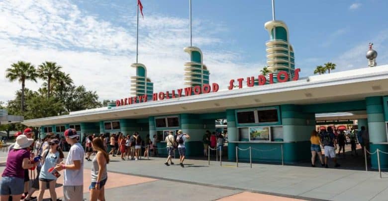 Guests outside of Disney's Hollywood Studios entrance at Disney World park.