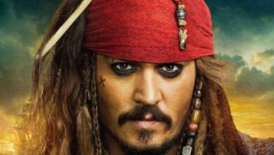 Jack Sparrow, with his signature red bandana, braided hair, and heavy eyeliner, gives an intense look to park guests.