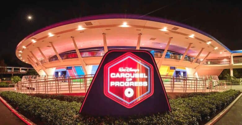 Nighttime view of the iconic carousel of progress attraction at Disney, recently evacuated, featuring its futuristic architecture and illuminated signage.