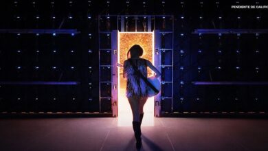 Taylor Swift steps through a luminous portal