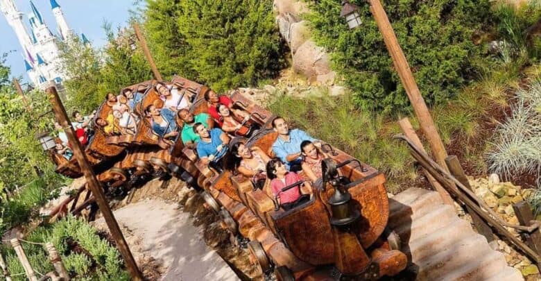 Guests riding Seven Dwarfs Mine Train