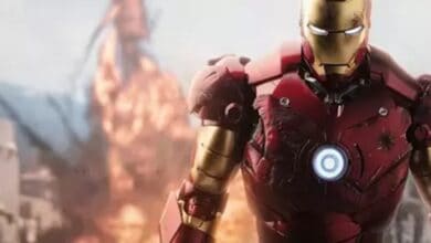 Iron Man greets guests in his striking red and gold suit as thrilling explosions and flying debris set the scene, capturing the excitement of a Disney Parks superhero encounter.