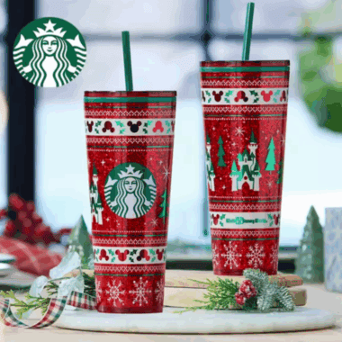 Red Disney Christmas Starbucks cups with castle and holiday motifs, perfect for Disney themed holiday celebrations.