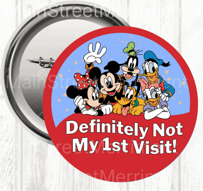 Mickey and friends pin with "Definitely Not My 1st Visit!" message, Disney-themed collectible badge.