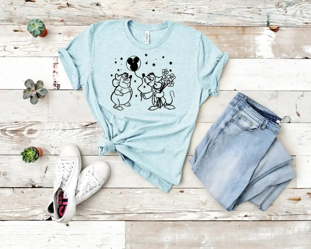 Cute Disney mouse graphic t-shirt with jeans and sneakers, perfect for Disney fans and fashionistas.