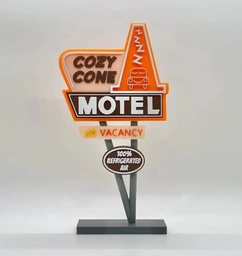 Cozy Cone Motel neon sign with retro diner design and bright colors.