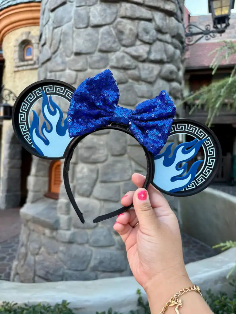 Flaming flame blue sequin bow Minnie Mouse ears headband, Disney fashion accessory, perfect for Disney parks and costumes.