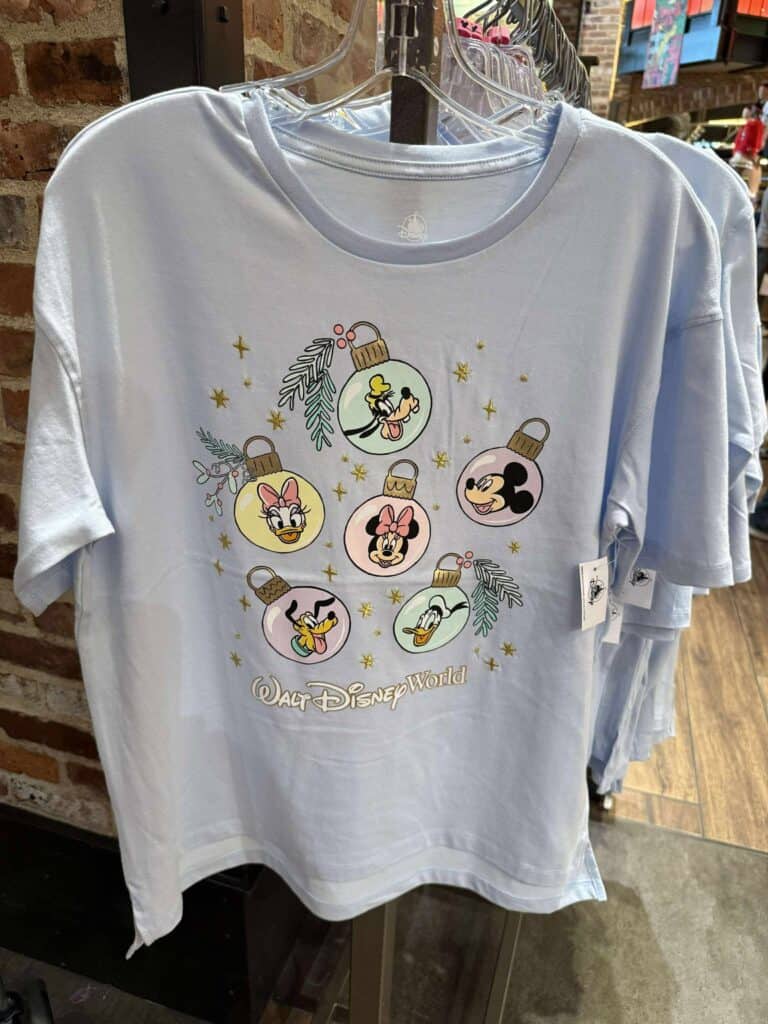 Walt Disney World holiday-themed T-shirt featuring Disney characters as ornaments with festive decor, perfect for Disney fans.