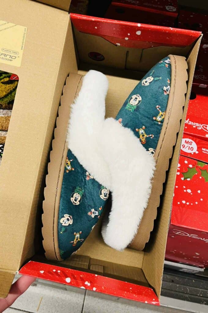 Disney Mickey Mouse plush slippers with fluffy white lining and colorful character print.