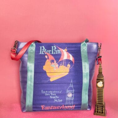 Colorful Disney Peter Pan themed tote bag with "Fantasyland" design and Big Ben keychain.