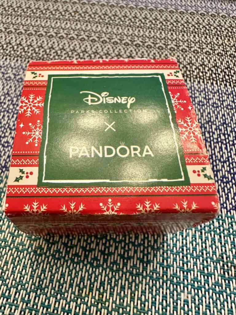 Festive Disney Pandora jewelry box with holiday snowflake and holly design.