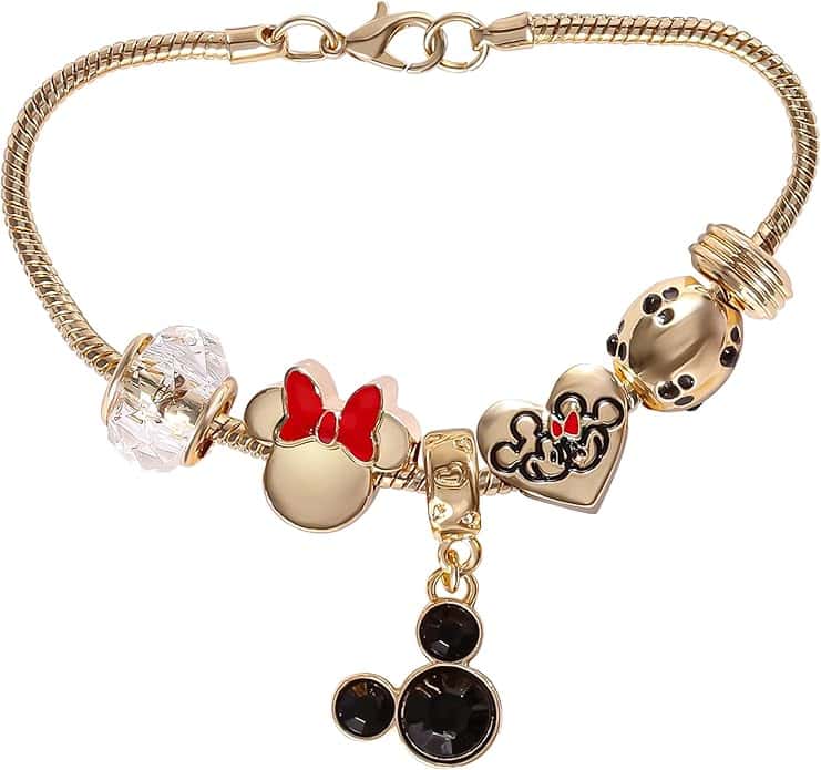 Gold Disney charm bracelet with Minnie Mouse, Mickey, and heart charms. Perfect Disney jewelry for fans.