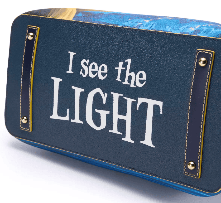 Bright blue Disney tote bag with "I See the Light" quote, perfect for Disney fans and fashion lovers.