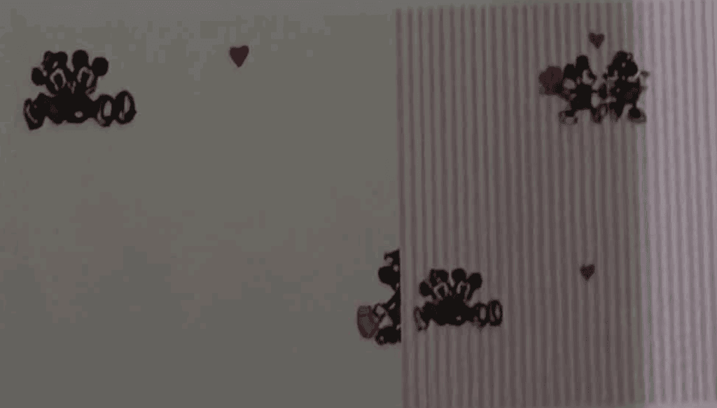 Decorative Mickey Mouse and heart-themed Valentine's Day wall art.