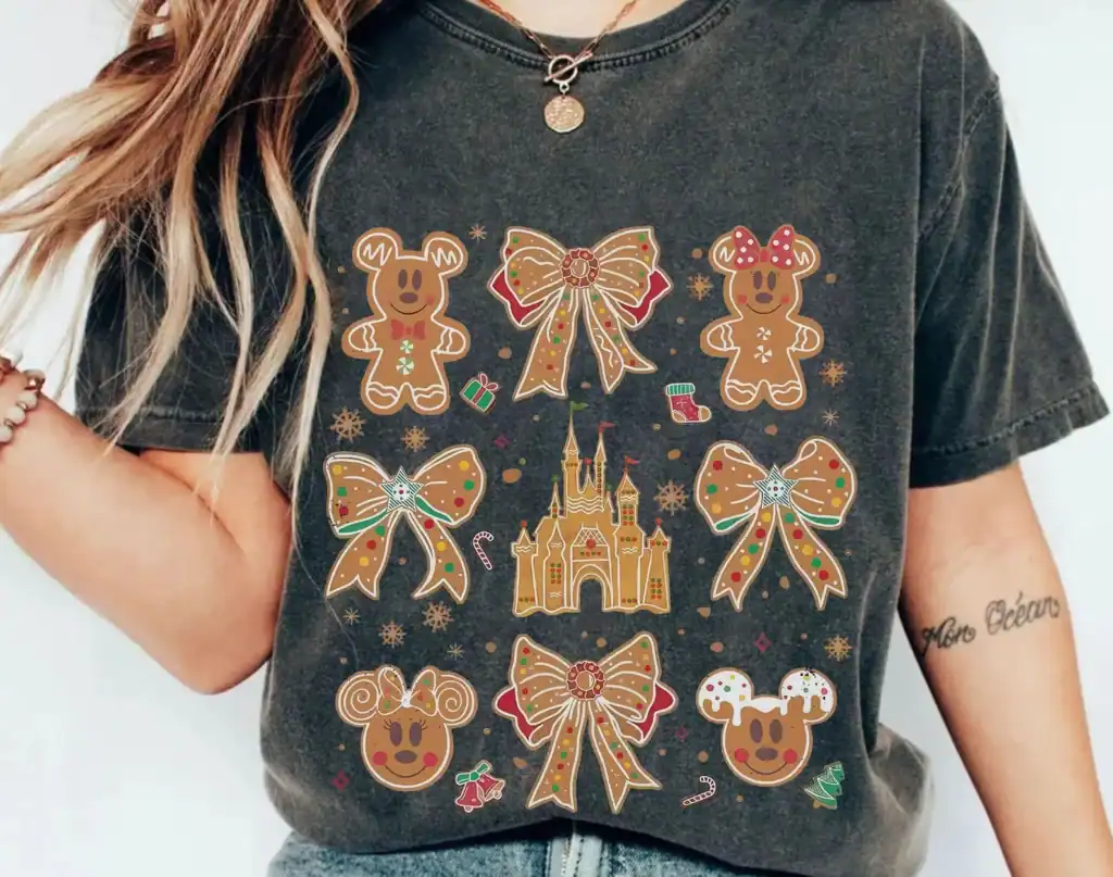 Festive gingerbread themed Disney t-shirt with holiday bows, castle, and ornaments.