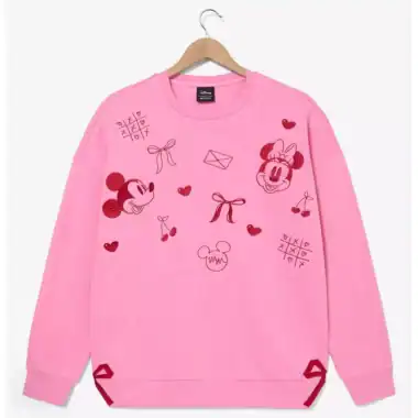 Pink Disney Minnie Mouse sweatshirt with playful graphics, hearts, bows, and game symbols.