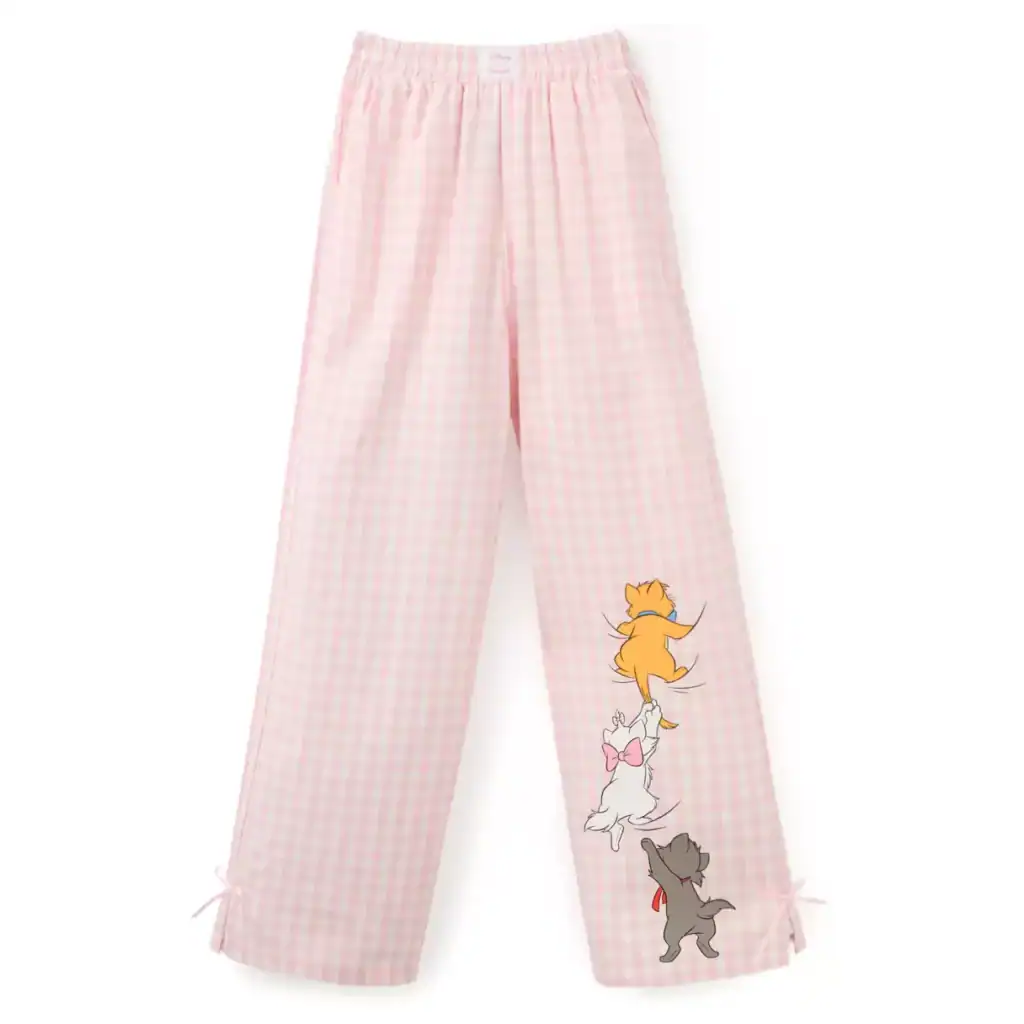Light pink gingham pajama pants featuring adorable puppies with bows and collars.